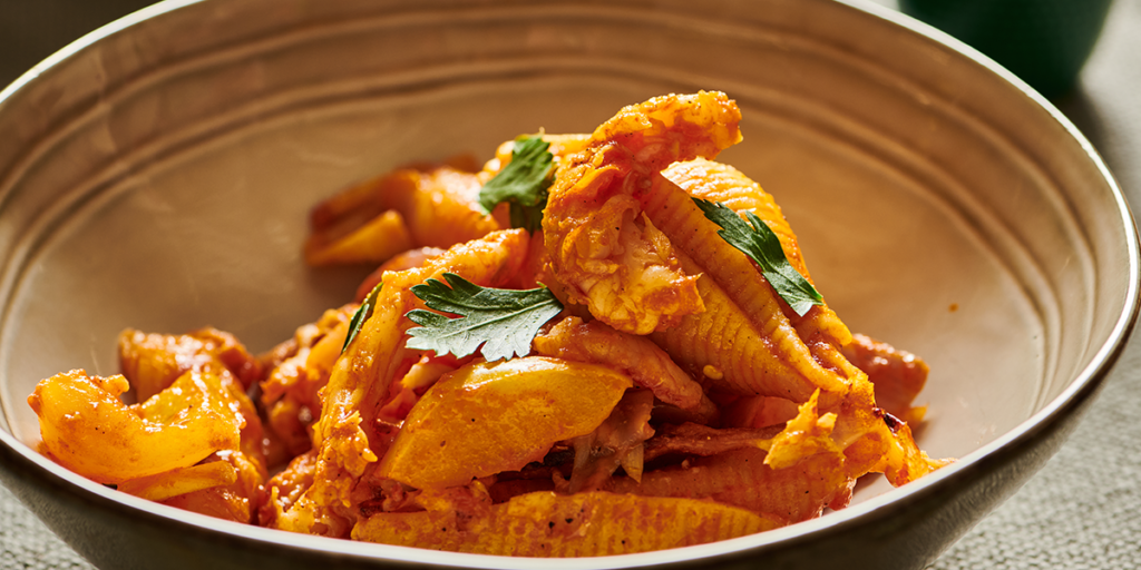 Pasta with pepper sauce and king prawns